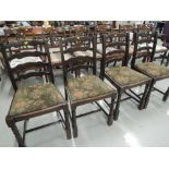 A set of four traditional ladder back chairs