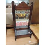 A Victorian stained frame hall wall mirror with candle box under