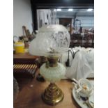 A Victorian vaseline glass well oil burning lamp