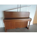 A teak cased upright piano by Schimmel, number 255.878, circa 1985/1986