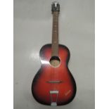 A vintage acoustic guitar, possibly junior, badged Oira?