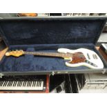 A Fender Jazz Bass guitar, made in Japan 1980s, serial number E727032, in fitted hard case, left