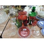 A selection of glassware including jars, cranberry and Loetz style jug