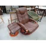 A modern stressless style armchair and footstool