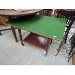 A vintage fold over tea/games trolley with green baize top