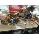 A selection of ceramic horse figures and caravan