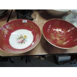 Two similar Coalport bowls having gilt heightened decoration and trifold legs, one with floral