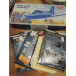 A model aircraft and selection of metal craft model kits