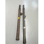 Two copper stirrup pumps