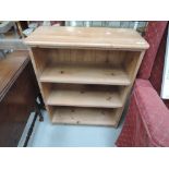 A pine low bookcase