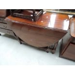 An early to mid 20th Century mahogany gateleg dining table