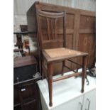 A bergere seated bedroom chair