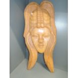 A wood carved Aztec type head