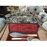 A selection of silver plated items including two butler trays, lidded tureen, pair of three sconce