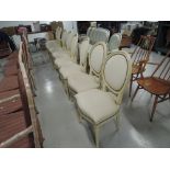 A set of 8 modern painted baloon back chairs with overstuffed seats and backs