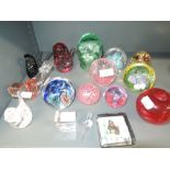 A selection of glass paperweights including Caithness