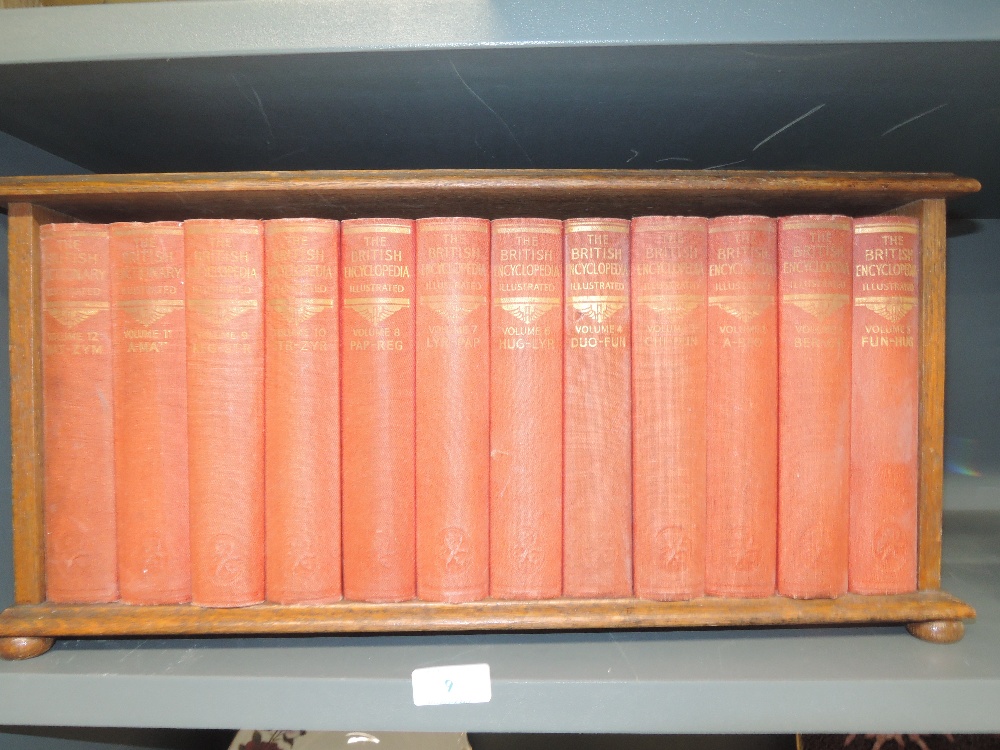 An small oak book shelf and vintage volumes