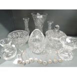 A selection of clear cut glass wares including lidded jar