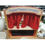 A selection of haberdashery and puppets including miniature theatre