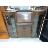 A mid 2th Century oak side by side bureau display