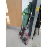 A selection of gardening tools including leaf blower and strimmer