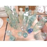 A selection of medical house hold and similar glass bottles some interesting designs