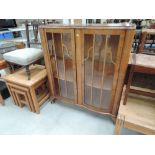 An early 20th Century walnut display cabinet