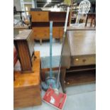 A vintage Ewebank style floor cleaner and a floor polisher