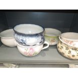 A collection of six chamber pots floral decoration