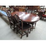 A reproduction regency mahogany dining table and set of 6 (4+2) dining chairs
