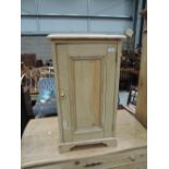 A stripped pine pot cupboard