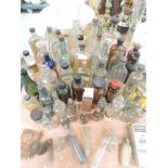 A good selection of medical and similar advertising bottles including Sloans