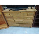 A modern golden oak sideboard/chest of drawers