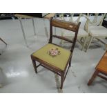 An early 19th century Regency design mahogany dining chair having rope twist back with later