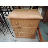 A modern pine compact chest of three drawers, approx 24' high