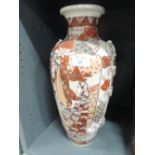 A tall oriental design floor vase