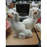 A pair of Victorian style Staffordshire fireside dogs