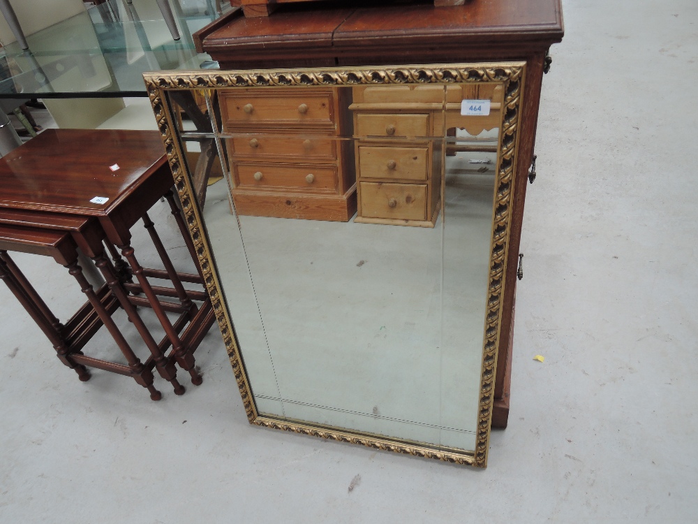 A gilt and plaster effect wall mirror