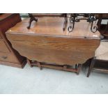 An early to mid 20th Century oak gateleg table