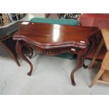 A reproduction continental style console table