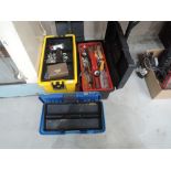 A selection of three tool boxes and contents