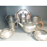 A selection of hammered pewter tea sets, vases and plates