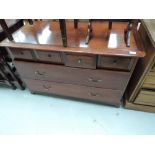 A modern mahogany bedroom chest of 4 jewellery over two long drawers