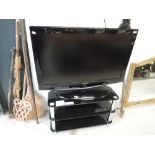 A Samsung 40' TV with stand