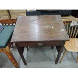 A vintage tilt top desk