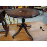 A reproduction Regency pedestal occasional table