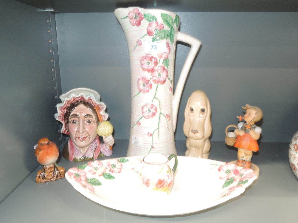 A selection of ceramics including Maling lustre vase and dish, Sylvac dog study, Goebel figurine,