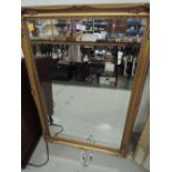 A modern gilt frame wall mirror