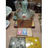 A selection of miscellaneous including tins, playing cards and vases