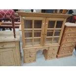 A pine glazed cabinet (has been matched with lot 462)